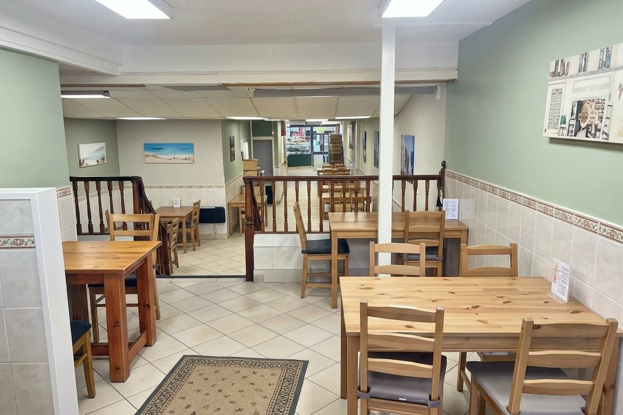 The café seating area inside Heils Bakery, with tables for guests